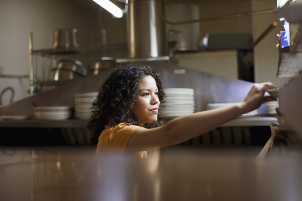 waitress working in kitchen