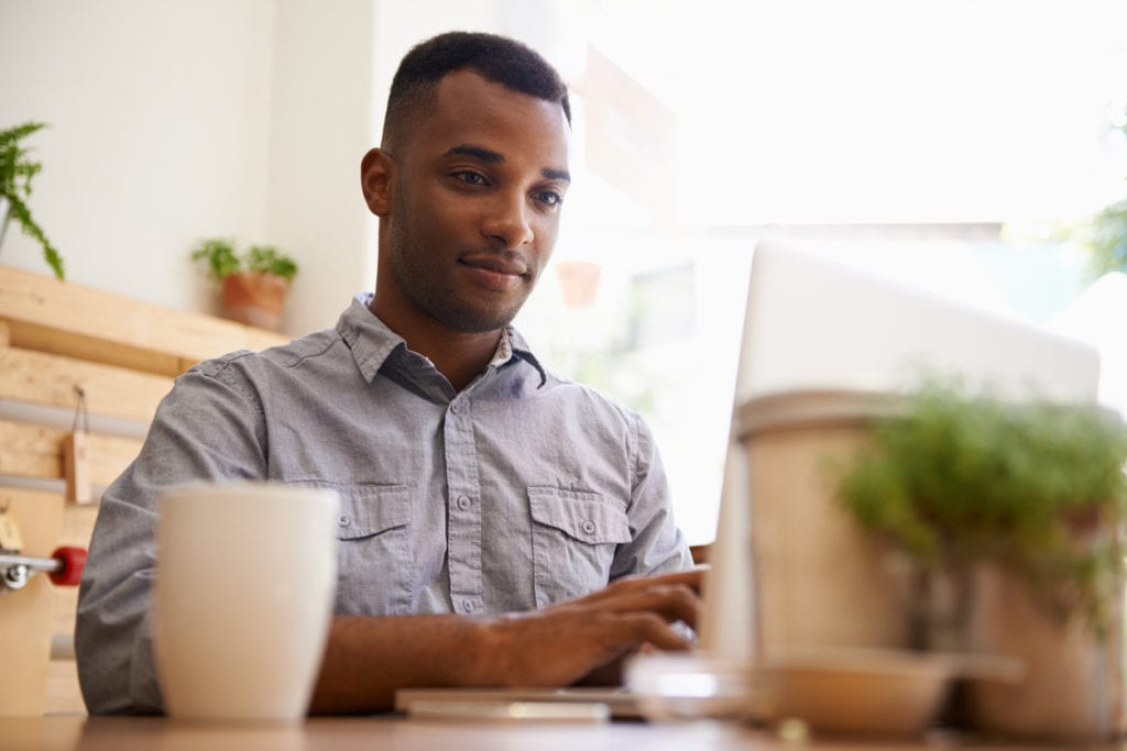 Man Paying Off Student Loans Faster By Using Tips Below