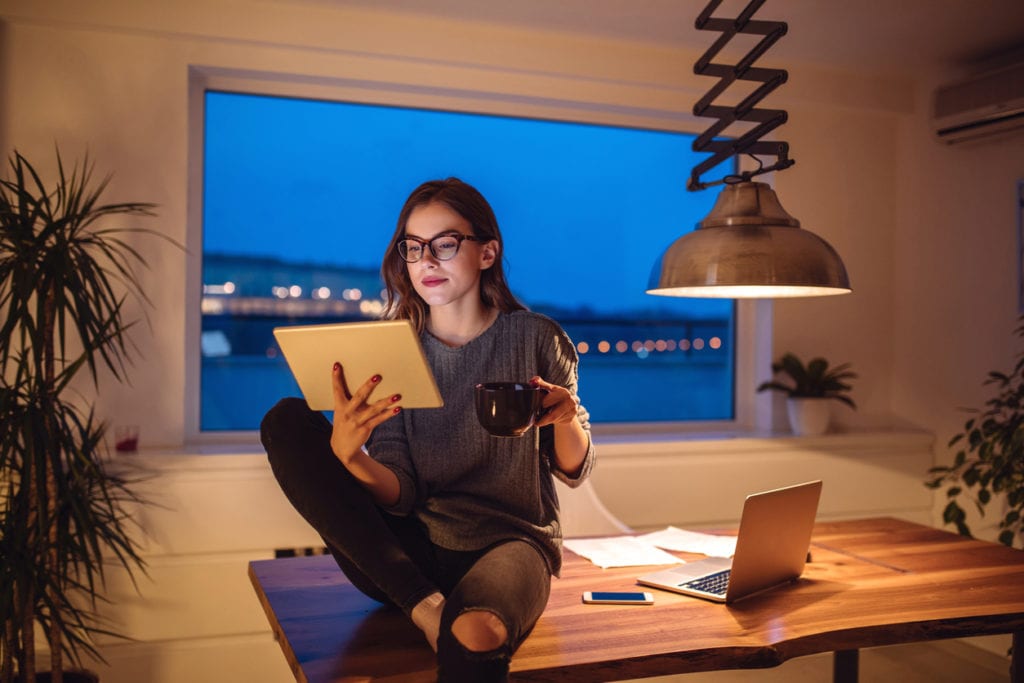 woman comparing student loan refinancing lenders