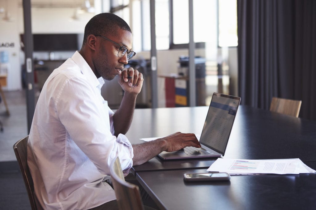 Man researching about discharging refinanced student loans