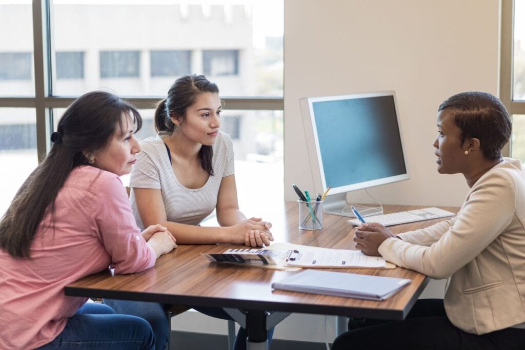 Woman and her cosigner applying for a student loan