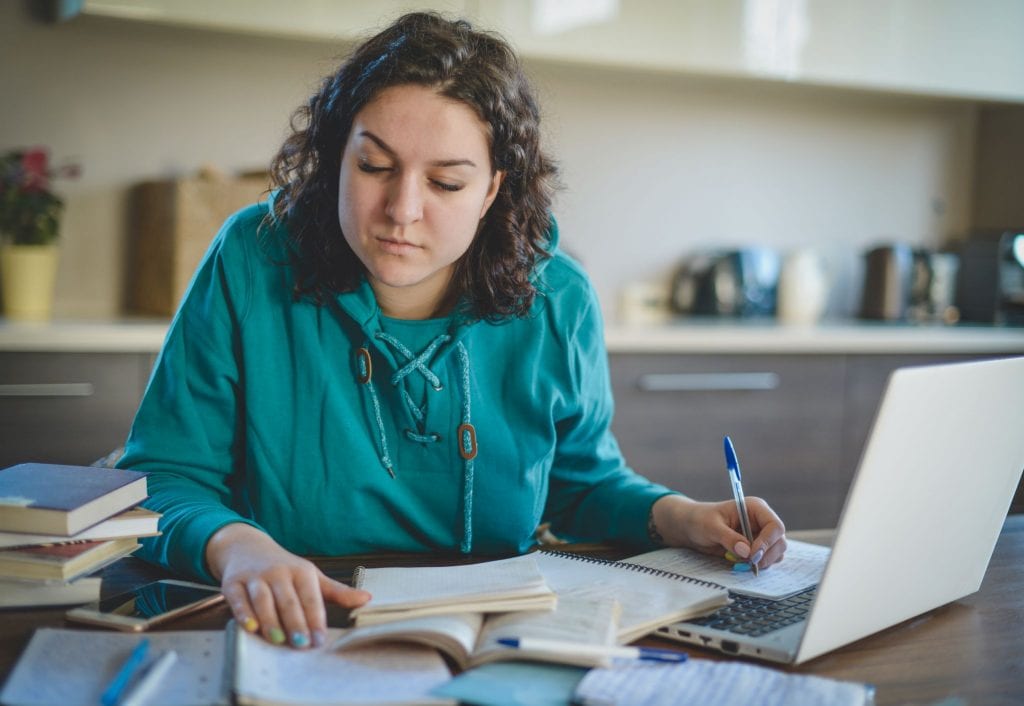 Woman calcluating how to pay for college