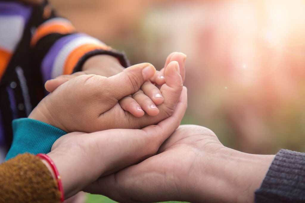 Father's mother's and baby's hand