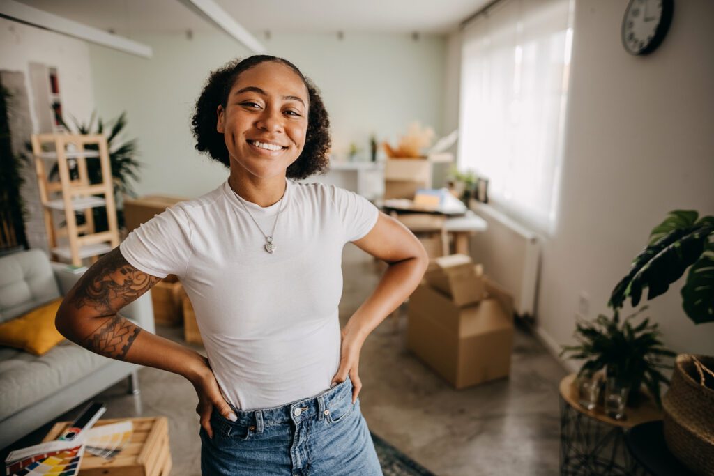 Young woman moving into new apartment