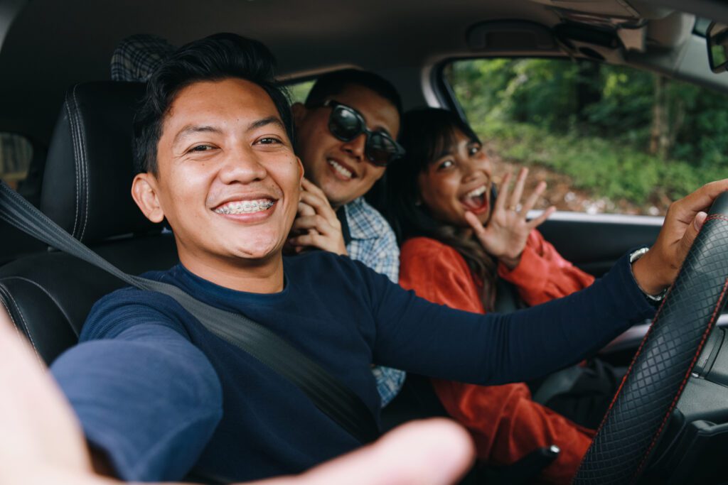 POV Selfie of Happy Young Friends Taking Selfie Inside The Car During Road Trip