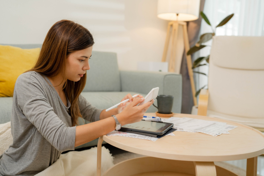 Female college student looking over finances.