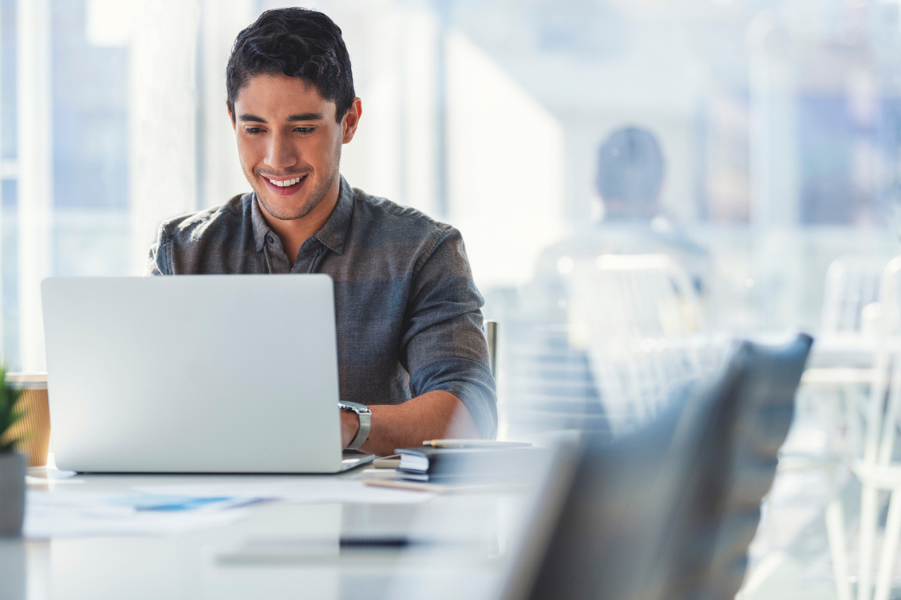 Young adult male working in an office.