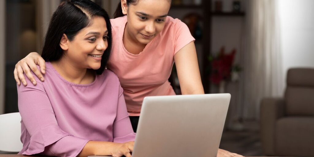 Mom and daughter looking up how to pay off parent plus loans faster.