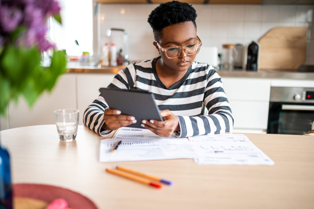 Young college student looking over tax documents