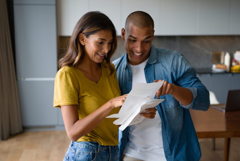 Woman and man getting good news in the mail