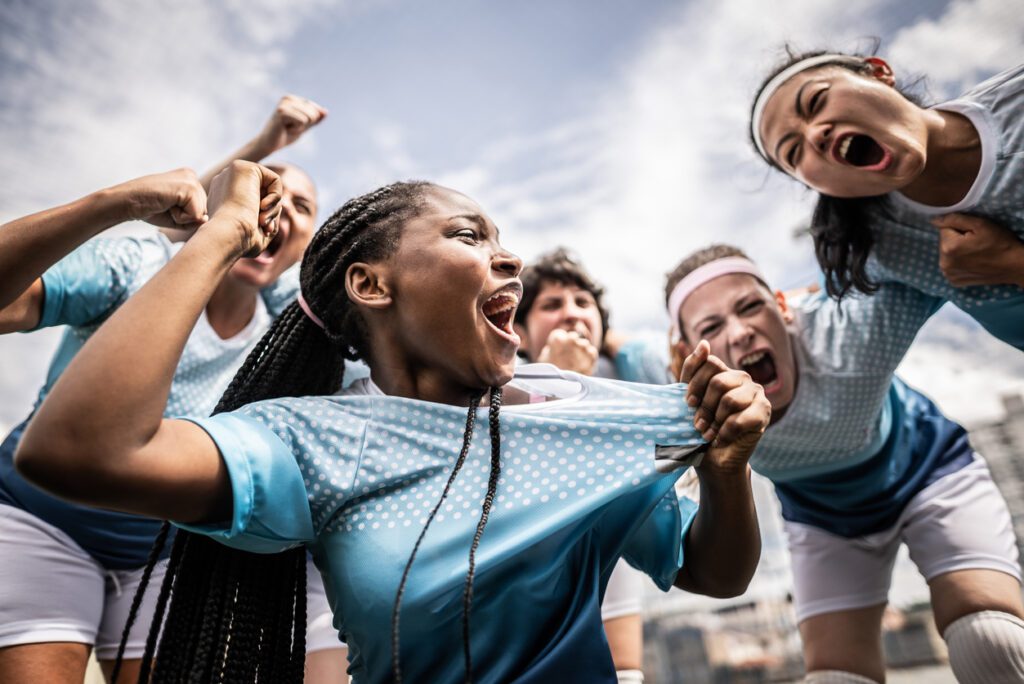 Portrait of a female soccer team celebrating