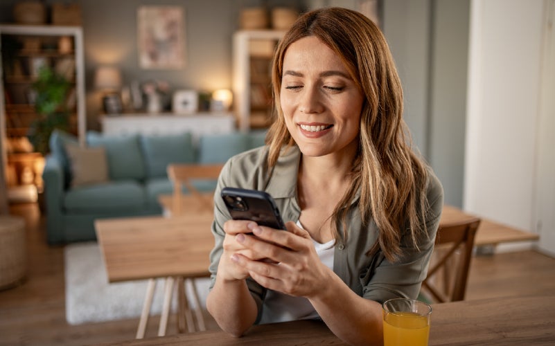 woman looking into the requirements to refinance her student loan debt